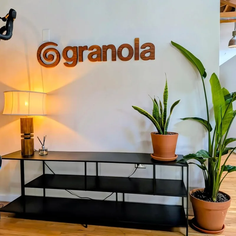 Dimensional California redwood Granola lettering on a white office wall